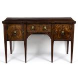 A George III serpentine sideboard, crossbanded, fitted cupboards and a drawer,