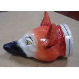 An early 19th Century Staffordshire stirrup cup in the form of a fox mask, 12.