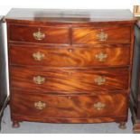 An early 19th Century mahogany chest of three long and two short drawers, on turned feet,