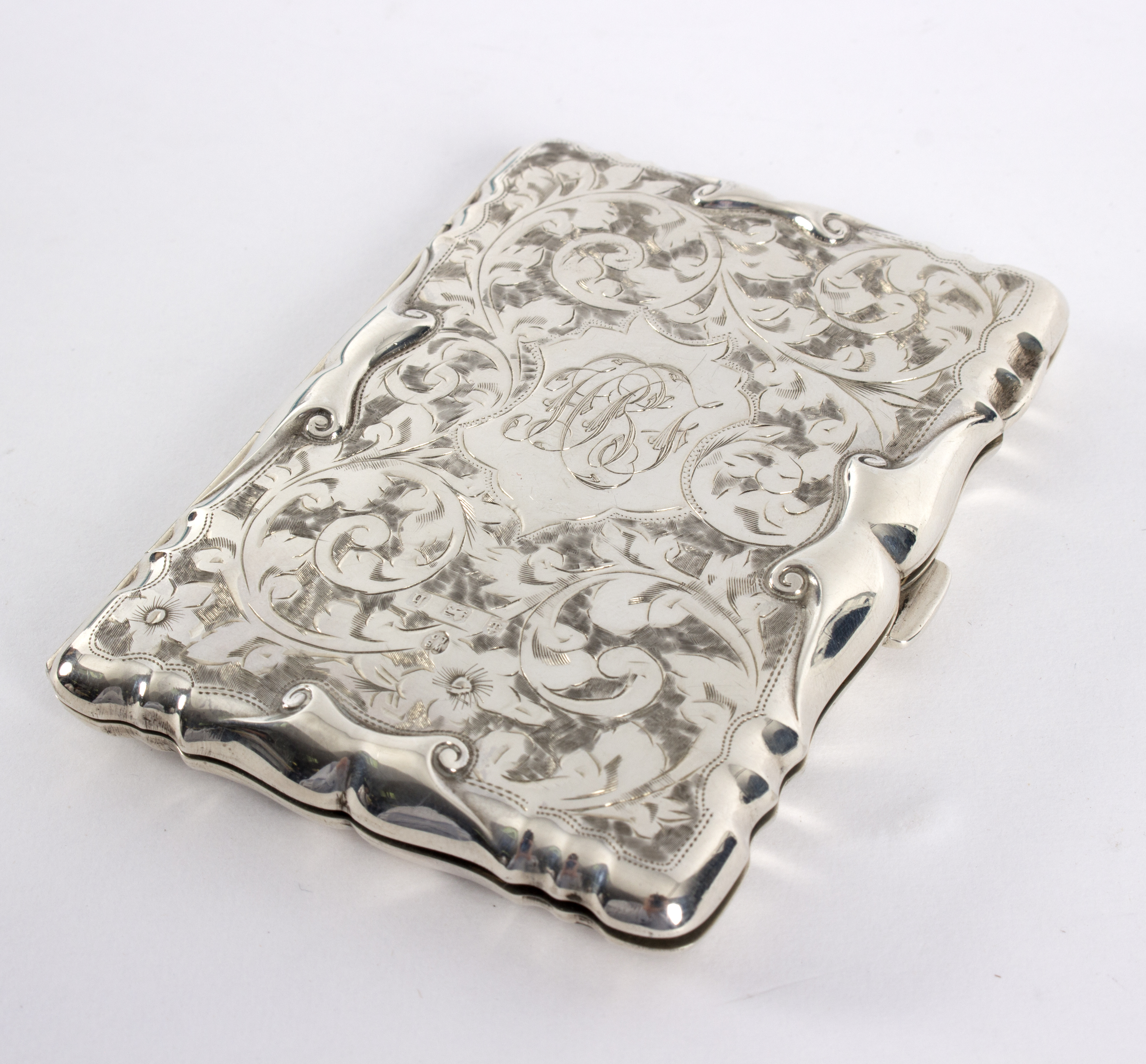 A silver aide memoire, VIB Ltd, Birmingham 1907, engraved with flowers and foliage, monogrammed, 9.