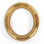 A 17th Century carved and gilded oval Lely type frame,