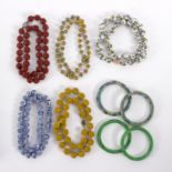 A group of Oriental jewellery to include two jade bangles, two cloisonne bangles,