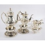 A group of silver plated tea wares and a silver lustre porcelain coffee/hot water pot