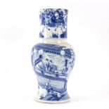 A Kangxi 18th Century blue and white vase decorated figures and pavilions within a landscape,