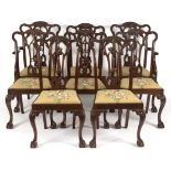 A set of eight 18th Century style dining chairs with pierced carved splat backs,