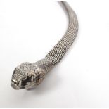 An Indian plated reticulated belt in the form of a snake with engraved snake head clasp,