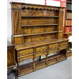 An oak Bylaw dresser with shelves and cupboards over, fitted four drawers and with pot board under,