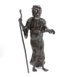 A Japanese bronze figure of a man holding a staff,