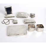 A silver heart-shaped pill box, Birmingham 1894, 4cm wide, three cigarette cases, a vesta case,