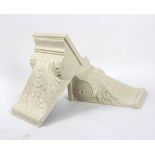 A pair of American neo-Classical style wall brackets, carved and white painted acanthus design,