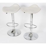 A pair of chromium telescopic bar stools with padded seats