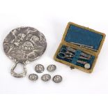 A Victorian silver mounted hand mirror, embossed angels,