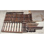 A quantity of turned banister supports, carved knops,