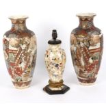 A pair of Japanese satsuma vases decorated actors and immortals,