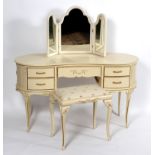 A kidney-shaped white painted dressing table,