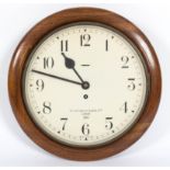 A Smiths eight-day wall clock, in a circular walnut case, the dial printed Smiths English Clocks,