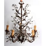 Liberty and Co, a chandelier, the scrolling wirework branches hung glass drops and another smaller,