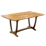 Cotswold School, an oak dining table, to a design by Edward Barnsley,