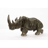 A Shona stone carving of a rhinoceros, 25cm high,