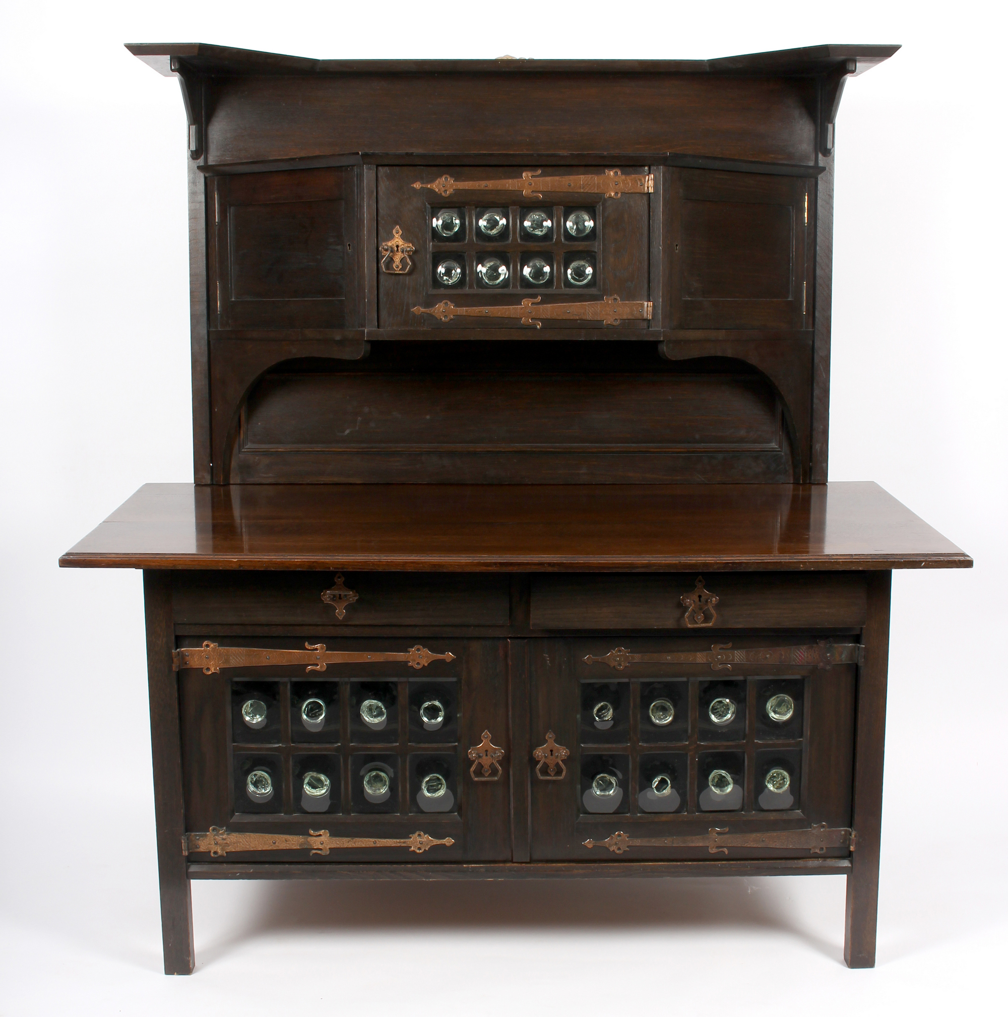 Manner of Leonard Wyburd for Liberty & Co, an oak Arts & Crafts sideboard,