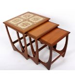 G Plan, a nest of three tables, the larger with tiled top,