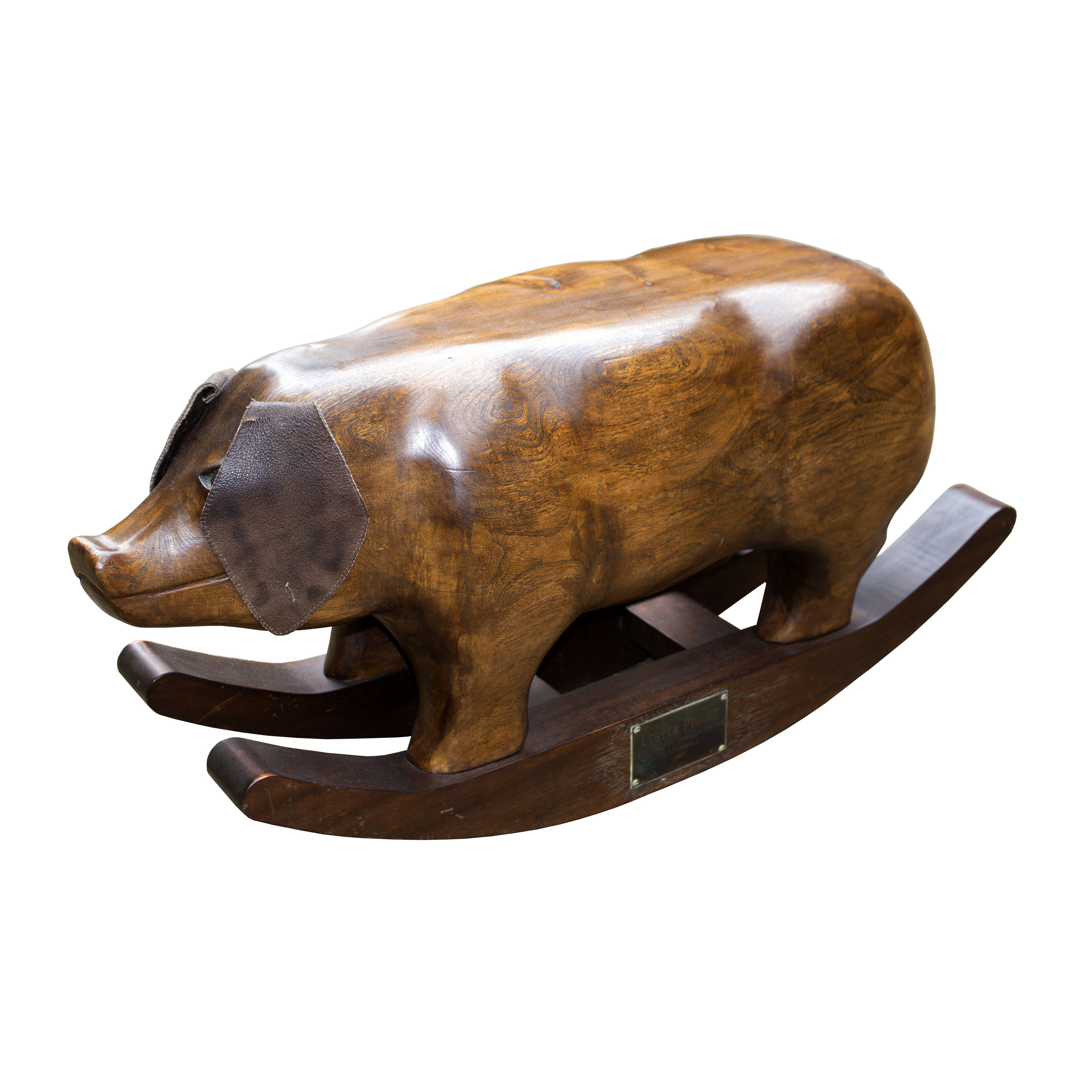 Camilla Swann, Lester Piglet, a carved elm rocking pig with leather ears, 46cm high,