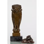 An Art Deco bronzed model of an owl on a square slate base and an interlocking figural group of a