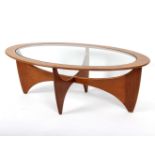 G Plan, a teak Astro coffee table, of oval form with glass inset top,