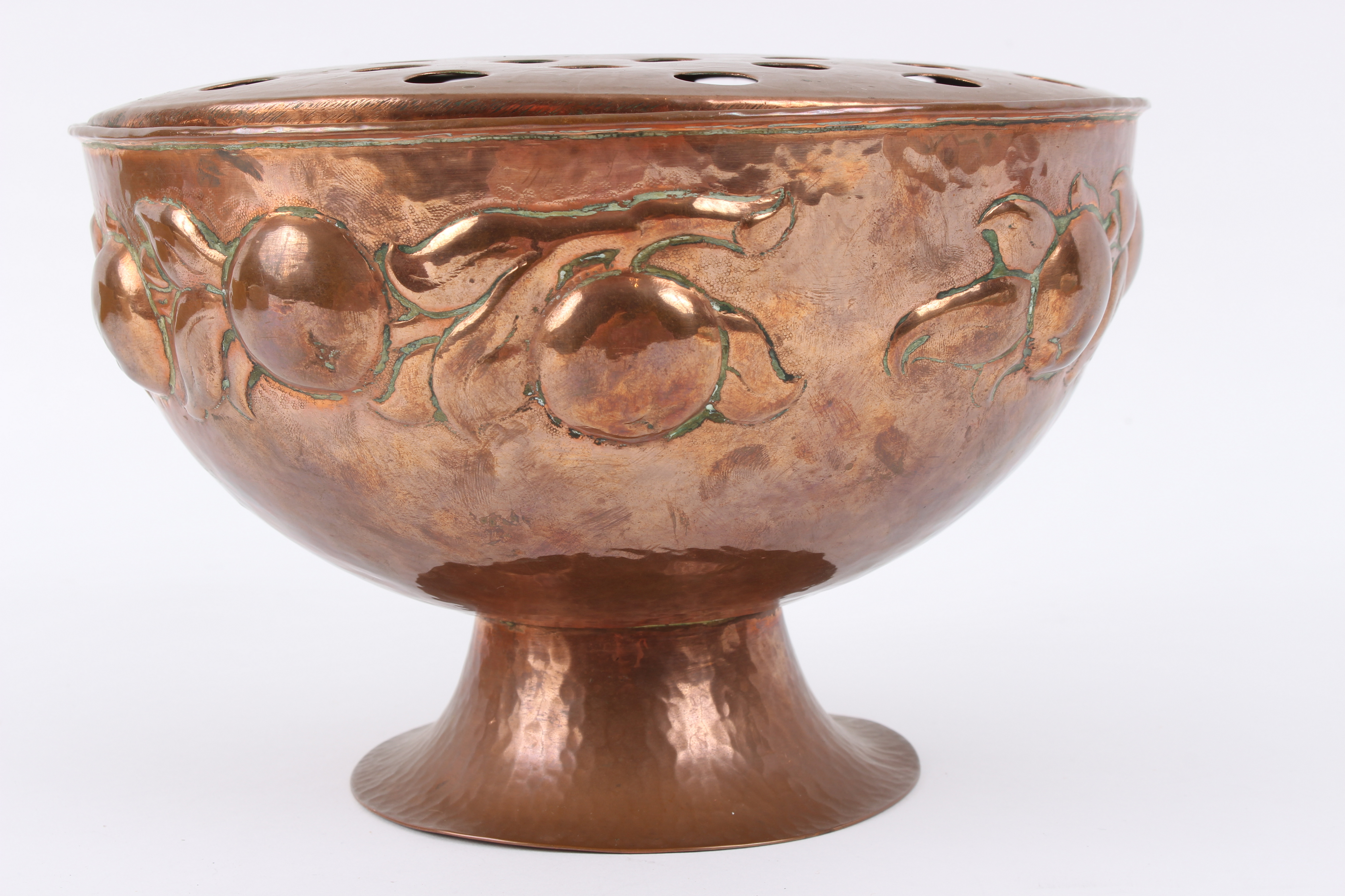 A Newlyn Arts & Crafts copper rosebowl, the bowl with embossed decoration of stylised apples,