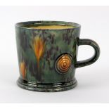 Walter Keeler (British, born 1942), a Whieldon style glazed mug in yellow green applied roundels,