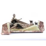 An Art Deco style spelter, marble and onyx figure group of a female and two birds,