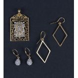 A pair of diamond pendant earrings of teardrop cluster form,