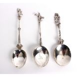 Three Dutch silver spoons each with decorative handle and figural finials,