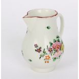 A Bristol milk jug painted with flowers,