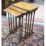 A nest of three mahogany tables, late 19th Century, on turned supports and stretchers,