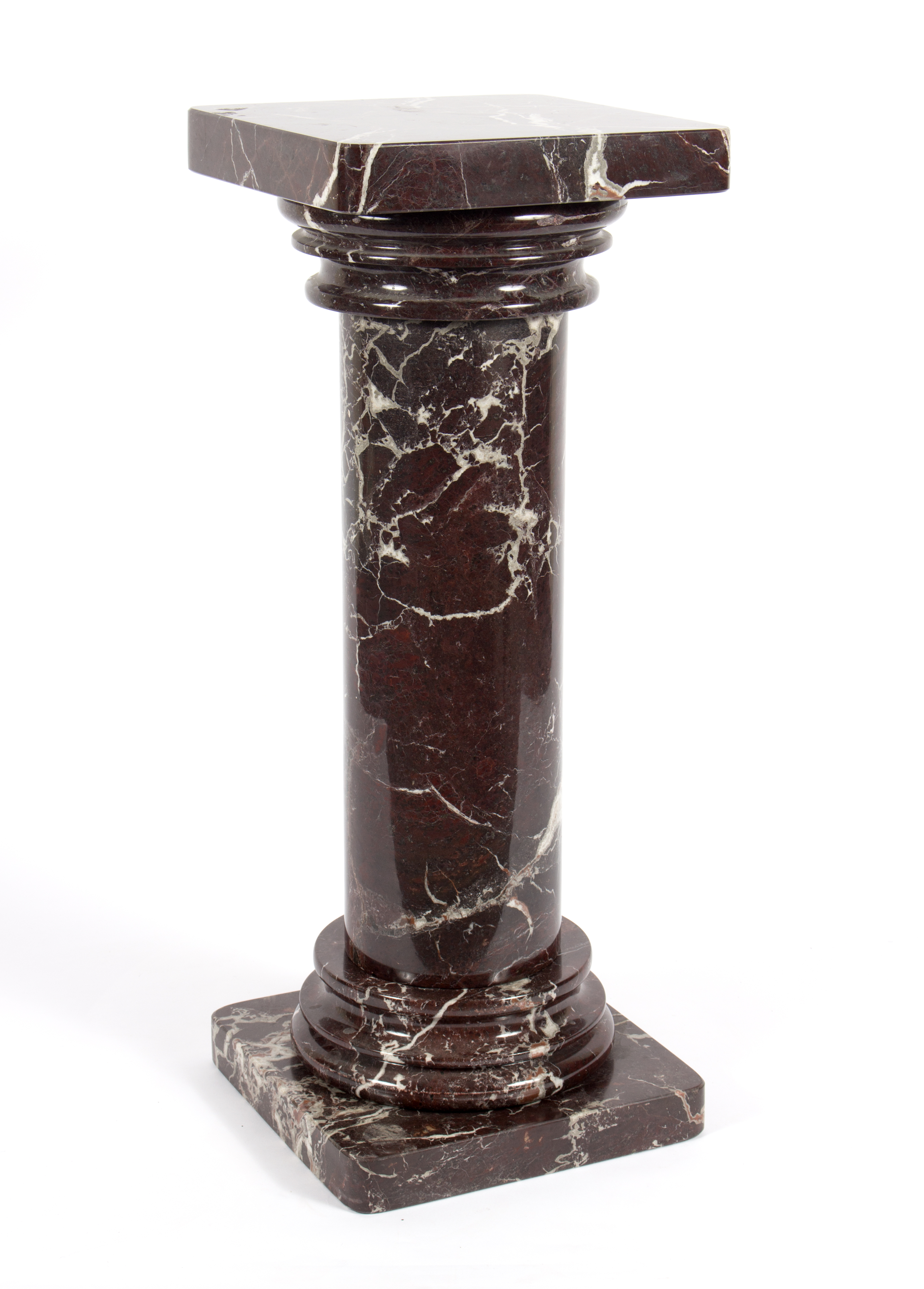 A red and white veined marble column, the hollowed column on a square base,