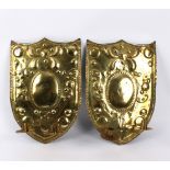 A pair of Dutch brass shield-shaped girandoles, each fitted two sconces,