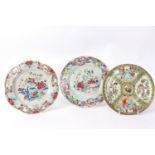 A Chinese famille rose plate, with gently lobed border enamelled with a vase, rockwork and flowers,
