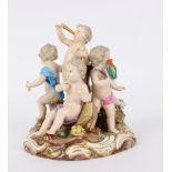 A Meissen porcelain figure group emblematic of the senses, modelled as putti on a naturalistic base,