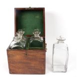 A fitted Georgian mahogany decanter box, including four original hand blown decanters,