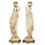 A pair of Royal Worcester blush ivory candlesticks with female figure supports (Grecian water