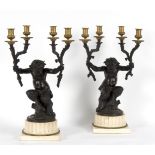 A pair of 19th Century bronze figural four-light table lights,