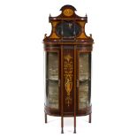 An Edwardian inlaid display cabinet with superstructure over and rounded doors to the sides,