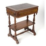 A Victorian walnut two-tier table with drawer,