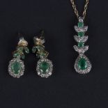 A diamond and emerald pendant,