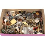 A quantity of costume jewellery including brooches, buttons, bangles etc.