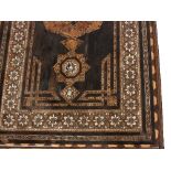 An Indo-Portuguese side table, the top inlaid geometric motifs to a multi-field border,