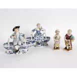 A pair of Meissen figural sweetmeat dishes,