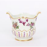 A Derby coffee cup with pixie ear handle, painted in polychrome with a spray of flowers, 6.