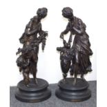 Two bronzed metal figures, after Moreau, titled Flore and Lesbi, each on a circular plinth,